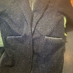 A brand new men’s coat size large color black